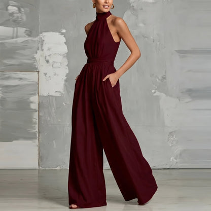 Close-up of the halter neckline design on the Evie blue wide-leg summer jumpsuit, showing refined feminine details.