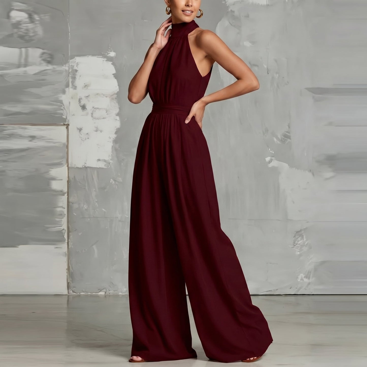 Overhead shot of the Evie burgundy wide-leg summer jumpsuit laid flat, showcasing its full silhouette.