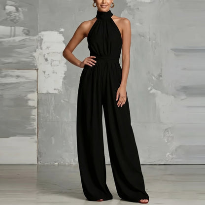 Back view of the Evie white wide-leg summer jumpsuit, showing the clean lines and comfortable fit.