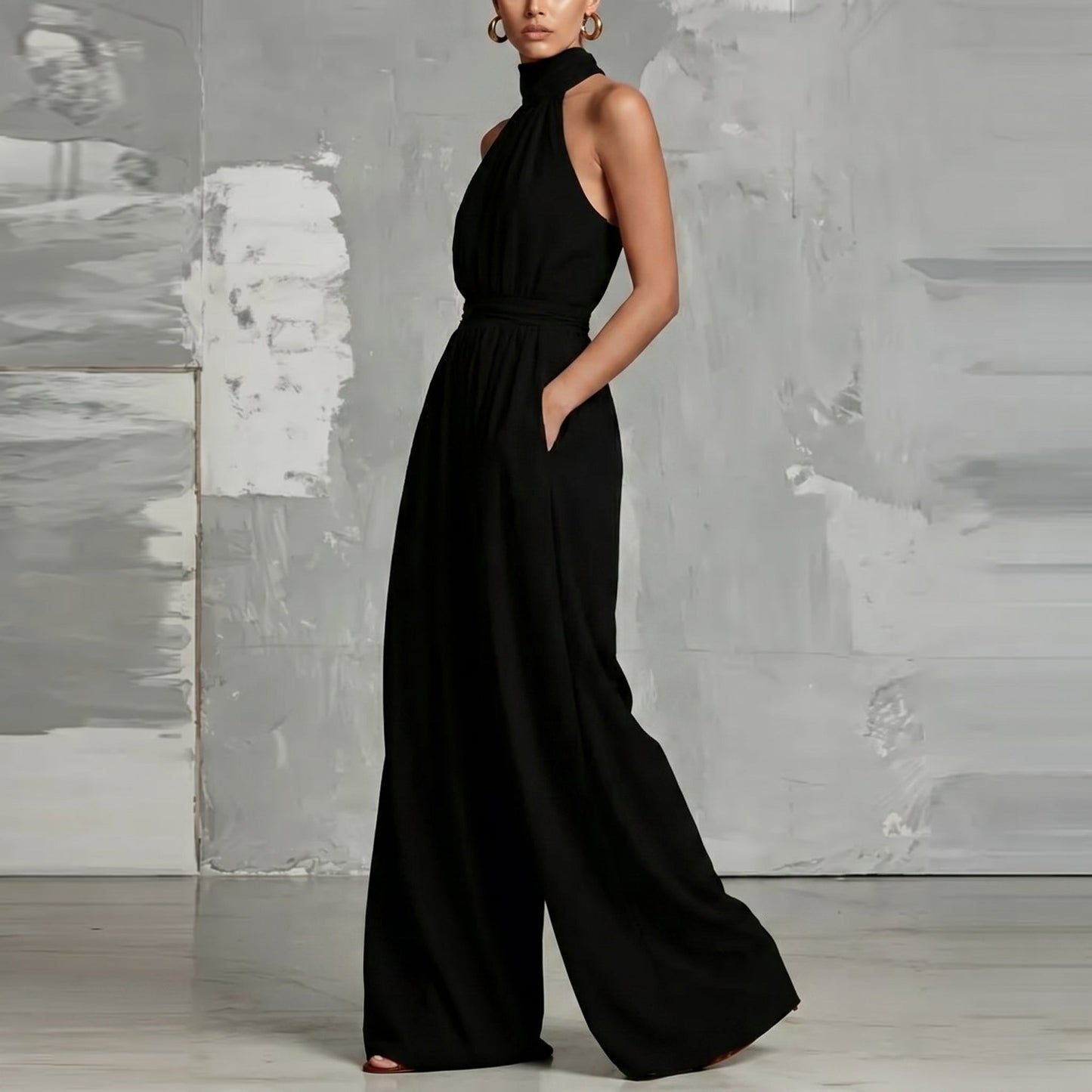 Model posing gracefully in the Evie blue wide-leg summer jumpsuit, perfect for an evening out.