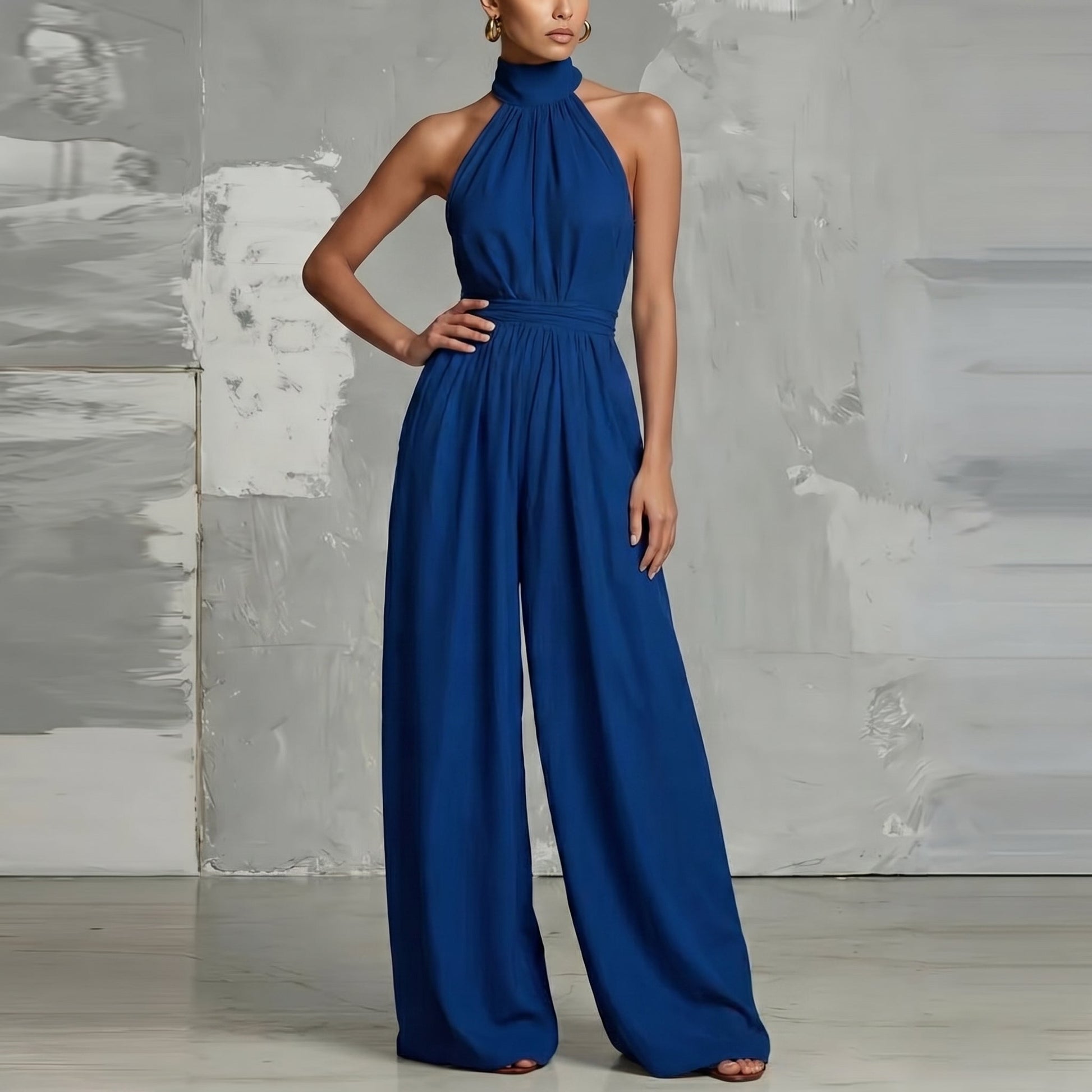 Evie black wide-leg summer jumpsuit displayed on a hanger, highlighting its minimalist design.