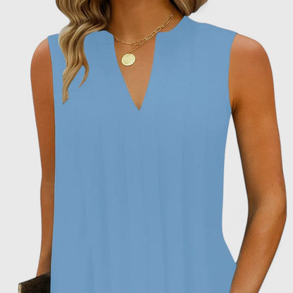 Close-up of the hemline on the blue midi dress, demonstrating the quality finish and elegant drape of the fabric.