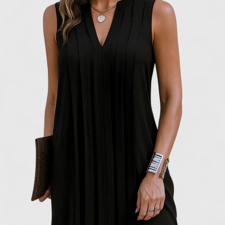 Back view of the black elegant v-neck midi dress, showing the seamless design and relaxed flow of the garment.