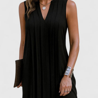 Back view of the black elegant v-neck midi dress, showing the seamless design and relaxed flow of the garment.
