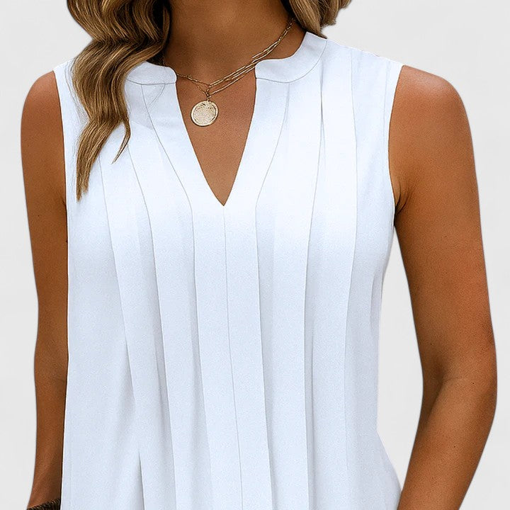 A model twirling in the white midi dress, demonstrating the airy movement and comfortable fit of the elegant garment.