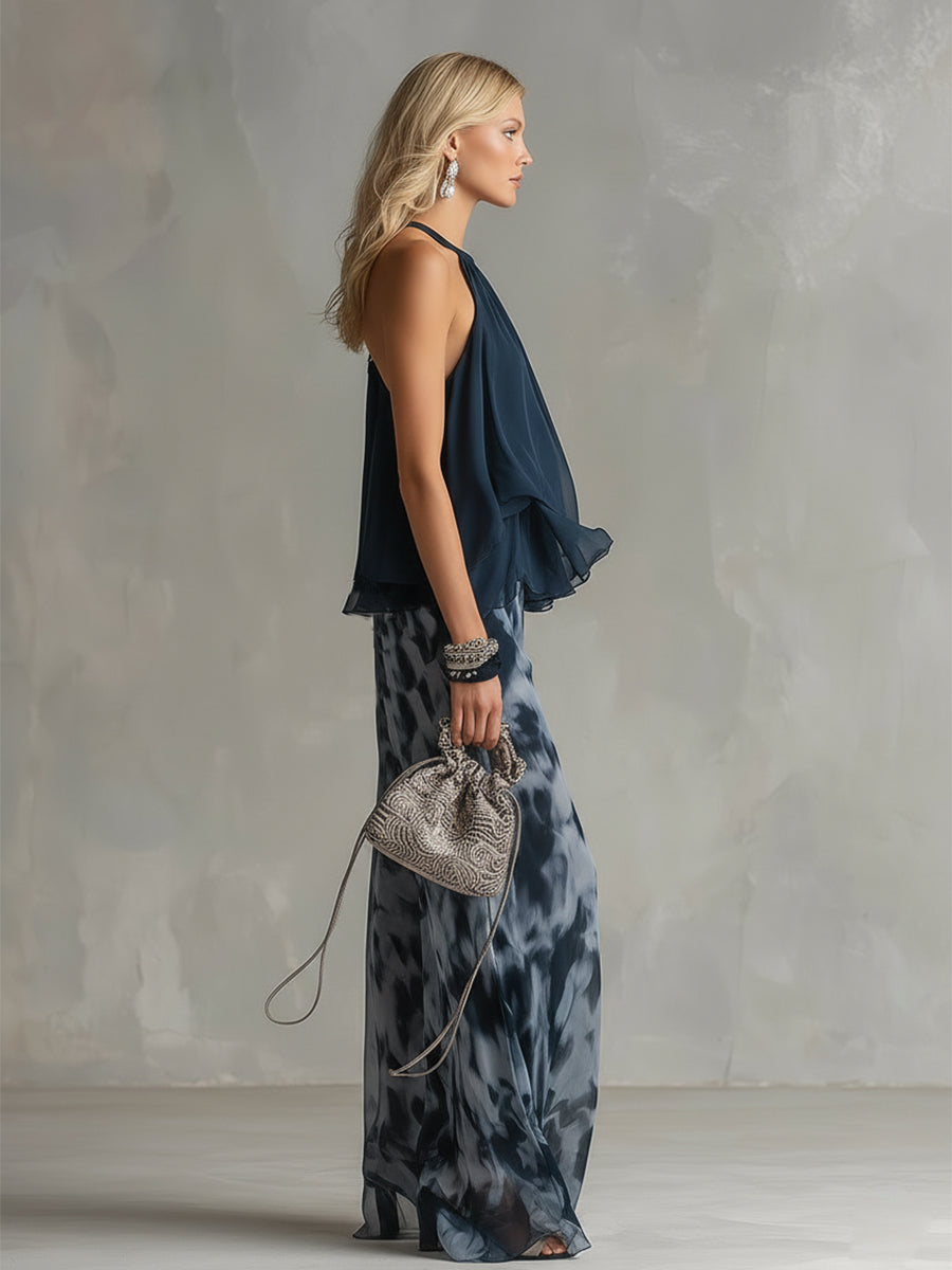 Close-up detail of the high-neck top and the unique print on the wide-leg chiffon trousers.