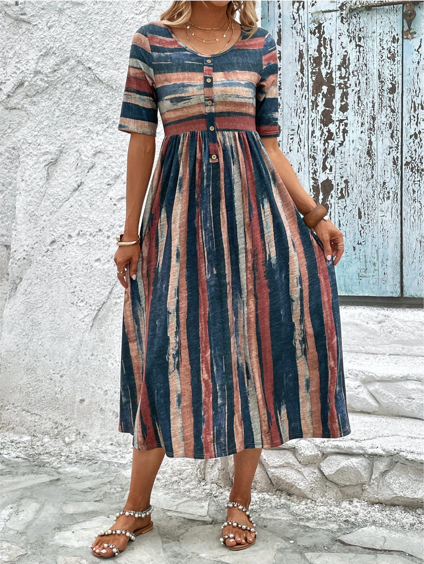 Close-up detail of the unique abstract pattern and soft fabric texture on the elegant Elara midi summer dress.