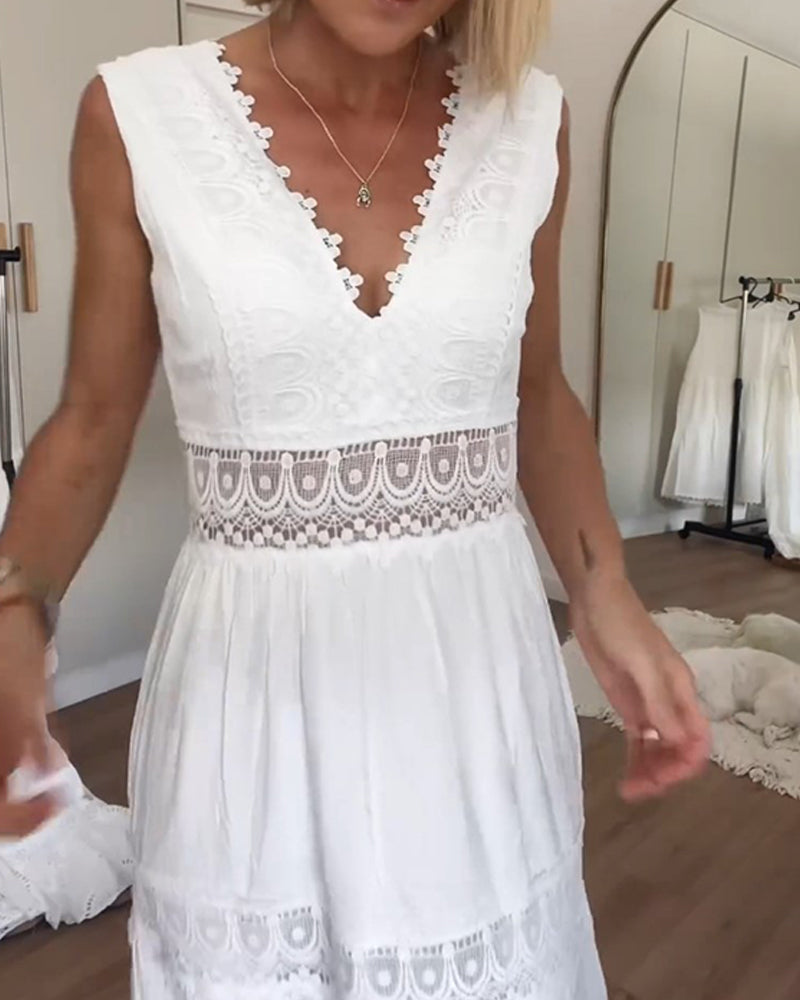Back view of the elegant white lace maxi dress, showcasing its graceful drape.