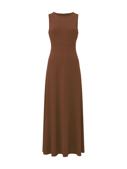 Model walking outdoors in the comfortable black maxi dress, portraying movement and ease.