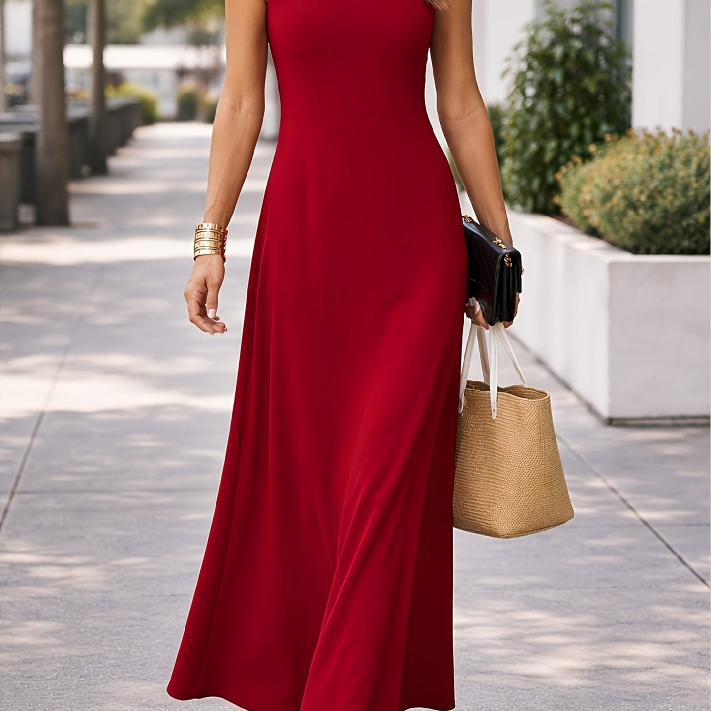 Close-up of the armhole and sleeveless cut of the black maxi dress, ensuring comfort.