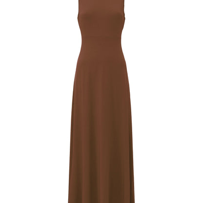 Model accessorizing the classic black maxi dress with a colorful scarf for a pop of color.