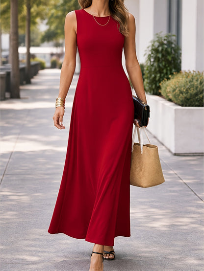 The Seraphina black maxi dress styled with a statement necklace, ready for an evening out.