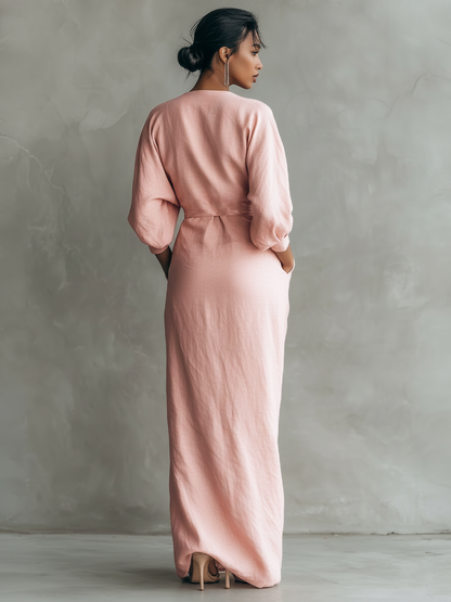 Side profile of a woman walking in the brown Marlowe maxi dress, emphasizing the relaxed and elegant drape.