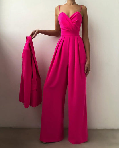 Model posing in the rose red Paloma jumpsuit, demonstrating its versatility for different occasions.