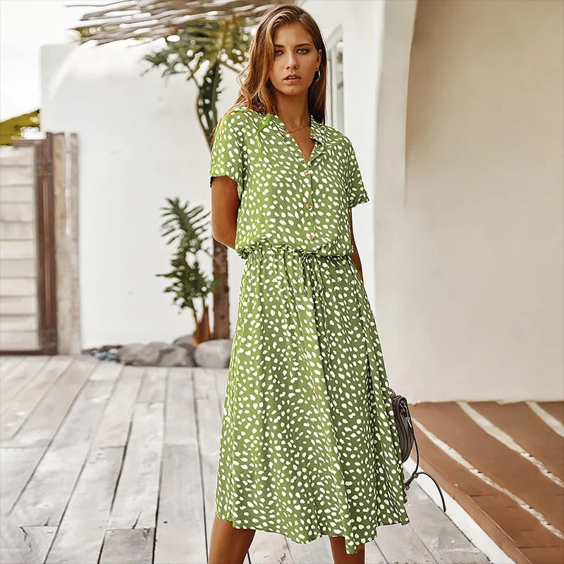 Side profile of a woman in the Juliette boho printed midi dress, highlighting the short sleeves and midi length.