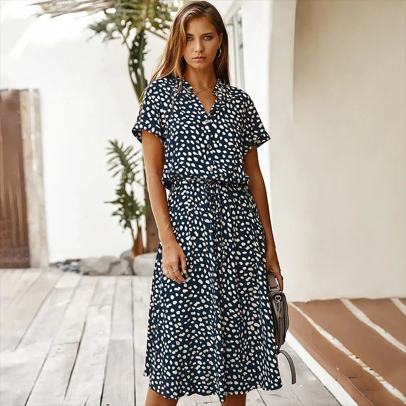 Back view of the elegant boho printed midi dress, emphasizing the overall drape and relaxed fit.