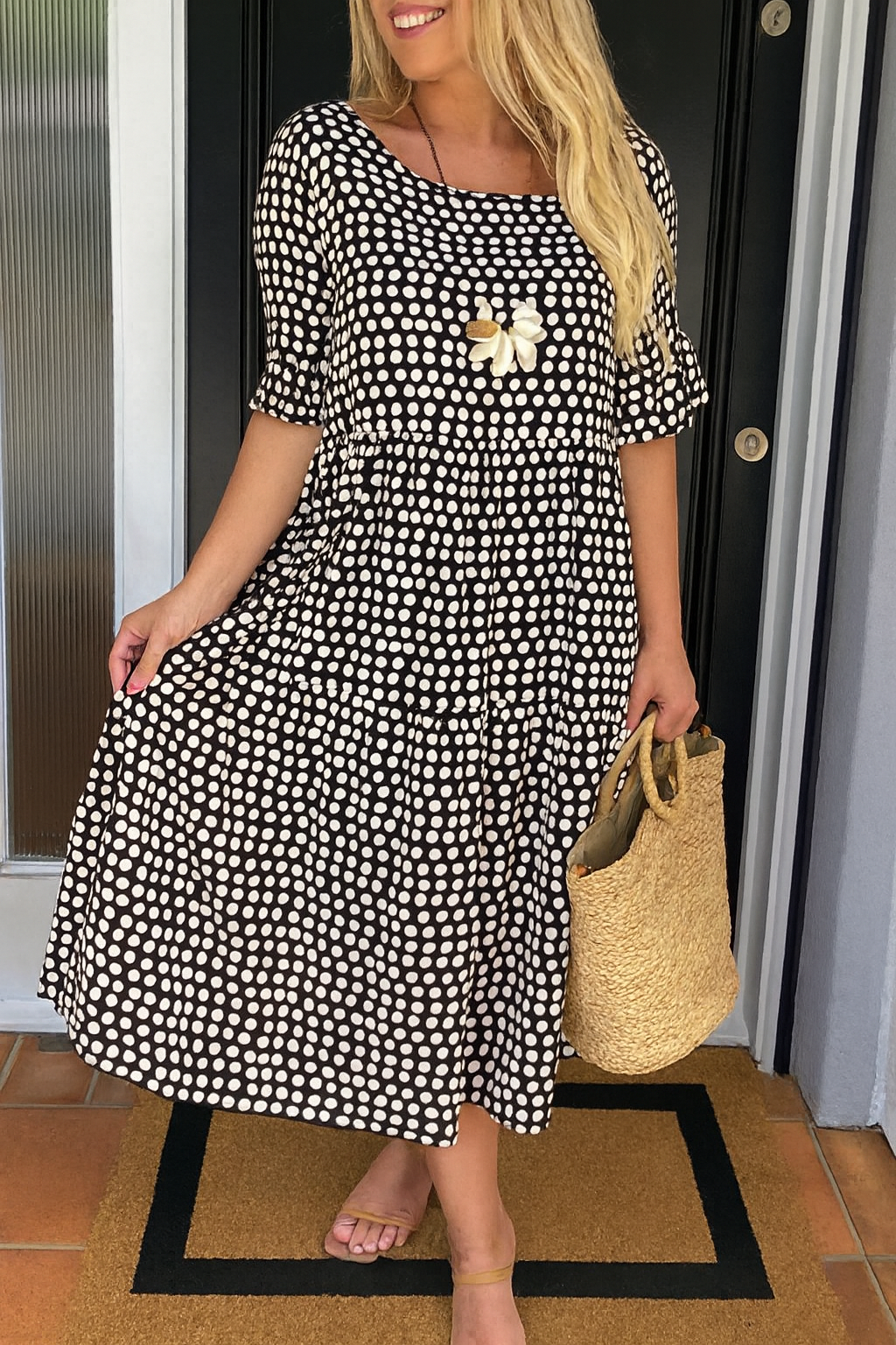Close-up detail of the breathable fabric texture on the Kaelani chic midi dress.