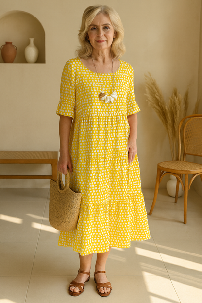 Kaelani chic midi dress in brown, folded neatly to display its versatile material and color.