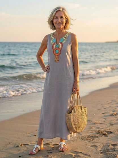 Close-up of the embroidered neckline on the sky blue Kalea midi dress, highlighting intricate detail.
