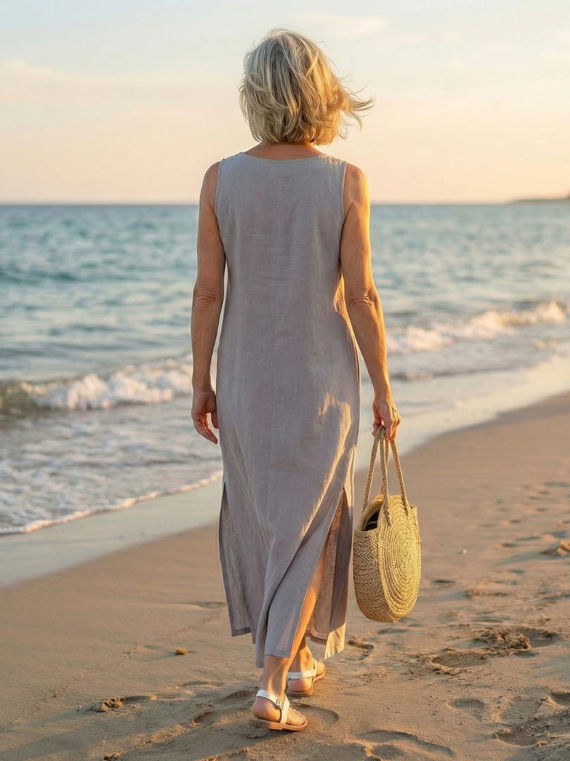 Lifestyle image of the white Kalea midi dress paired with accessories, suggesting a complete summer look.