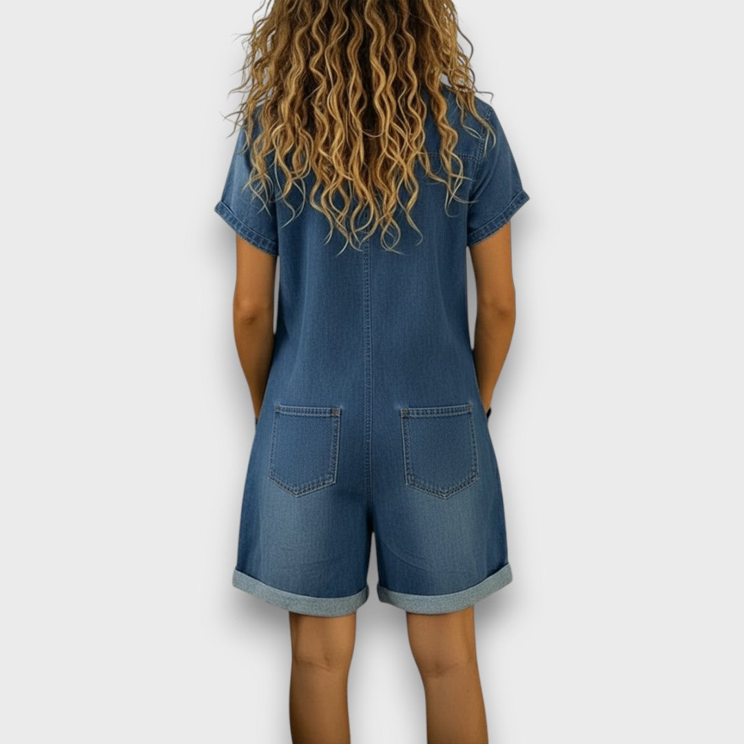 Close-up detail of the soft cotton blend fabric and stitching on the stylish denim jumpsuit.