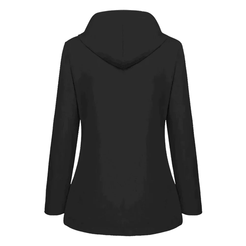 Side profile of a woman demonstrating the comfortable fit of a blue warm lined rain jacket with hood up.