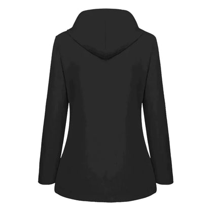 Side profile of a woman demonstrating the comfortable fit of a blue warm lined rain jacket with hood up.