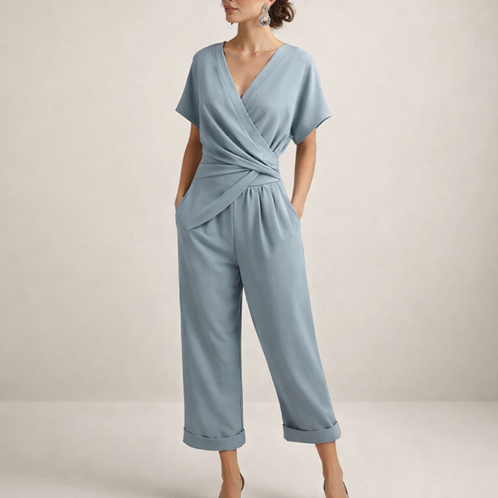 Close-up detail of the fabric texture and the flattering waist drape on the chic wrap jumpsuit.