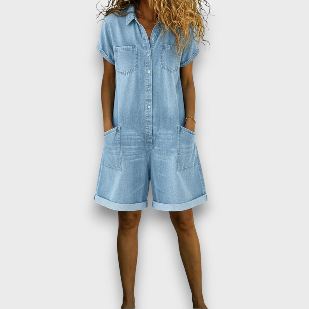 Lifestyle shot of a woman walking in a white denim jumpsuit, demonstrating its versatility for casual occasions.
