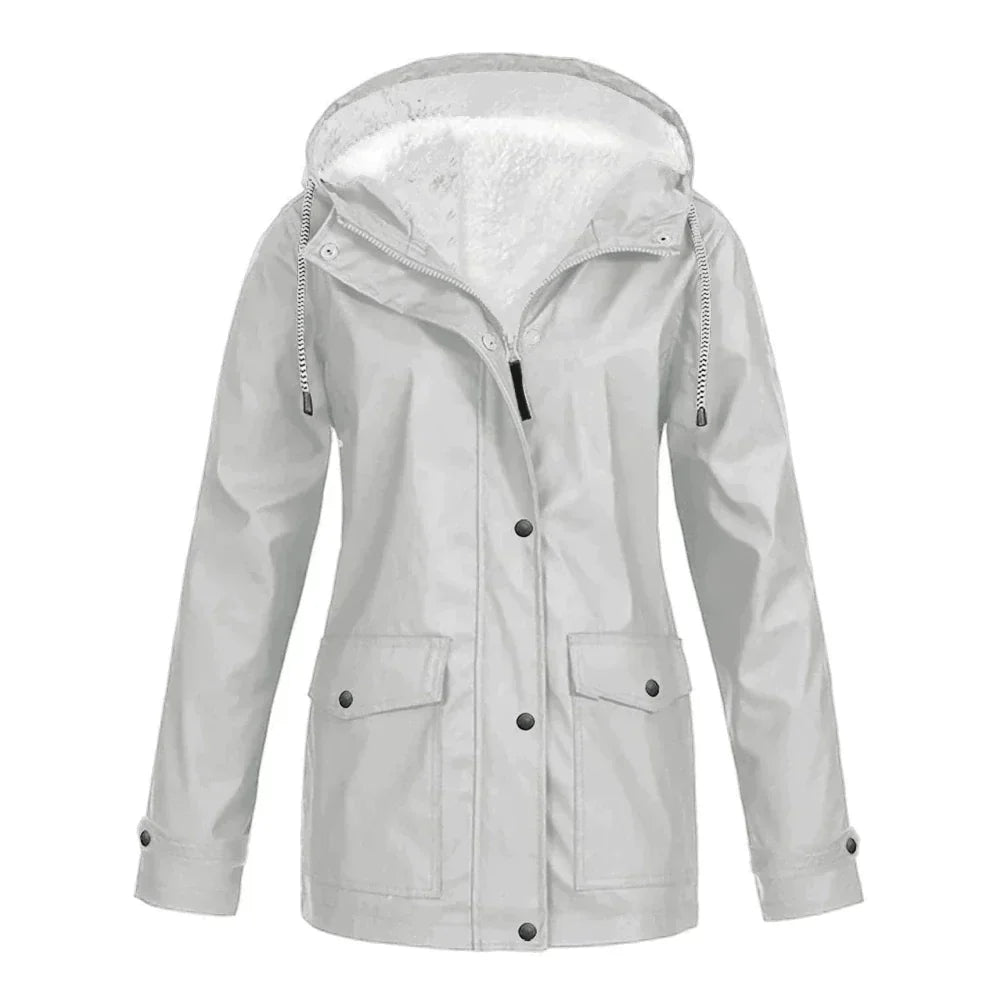 Detailed shot of the inner lining texture and warmth of the women's rain jacket.