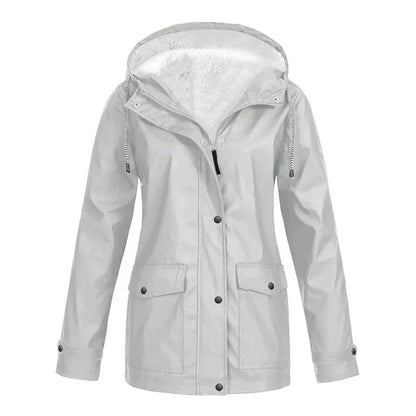 Detailed shot of the inner lining texture and warmth of the women's rain jacket.