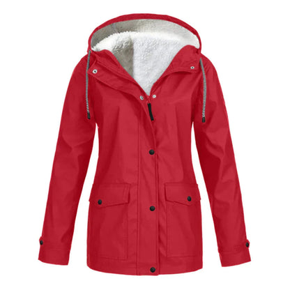 Lifestyle image of a woman in a black warm lined rain jacket, paired with casual attire.
