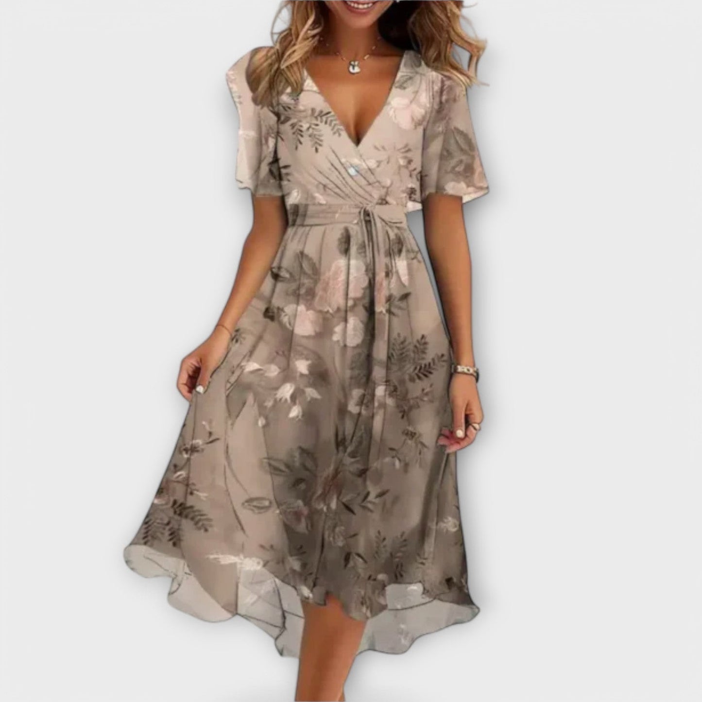 A model laughing while wearing the beige Leona midi dress, illustrating its comfortable fit and versatile charm.