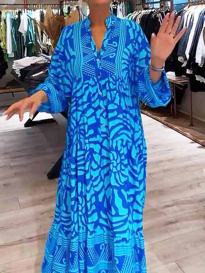 Front view of a woman wearing the blue Lila boho maxi dress, showcasing its flowy silhouette and V-neck.