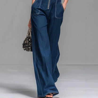 Detailed close-up of the front button fastening and stand collar on the Lila denim overalls.