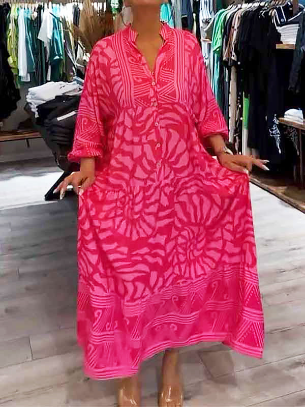 A woman happily twirling in the pink Lila boho maxi dress, emphasizing the generous volume and movement.