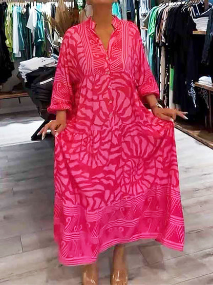 A woman happily twirling in the pink Lila boho maxi dress, emphasizing the generous volume and movement.