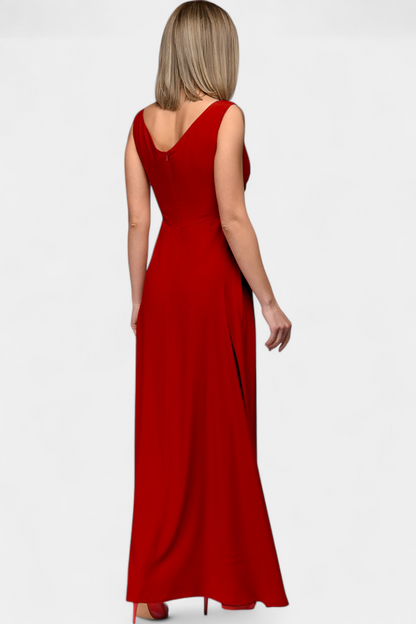 Model walking outdoors in the red Lila Draped Maxi Dress, showing the graceful movement of the skirt.