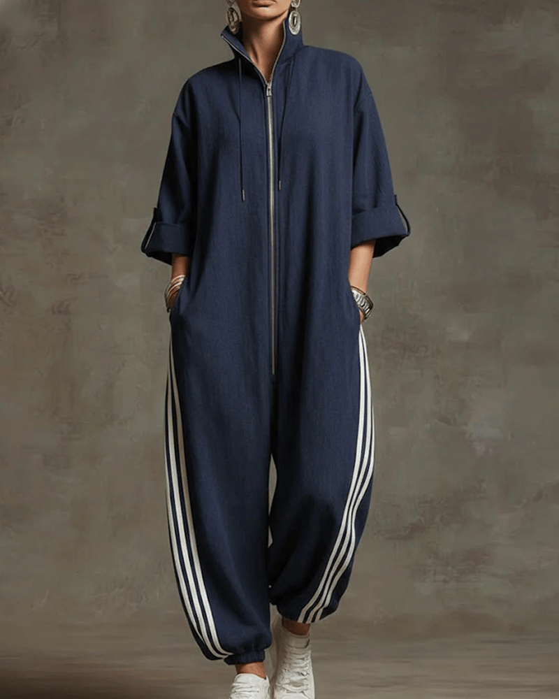 Full front view of a woman wearing the dark blue Lotte Women's Jumpsuit, posing casually.