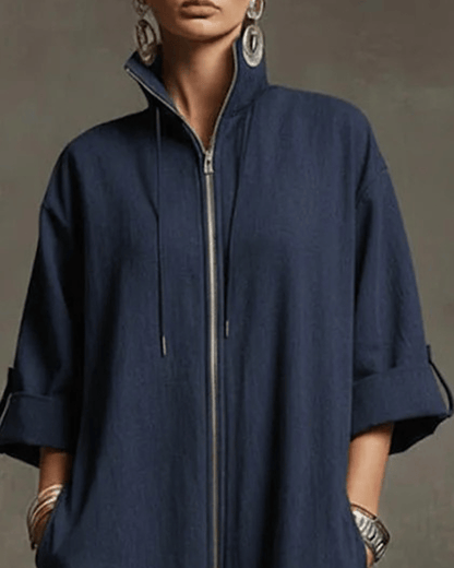 Side profile of a woman showcasing the relaxed fit and tapered leg of the yellow Lotte Women's Jumpsuit.