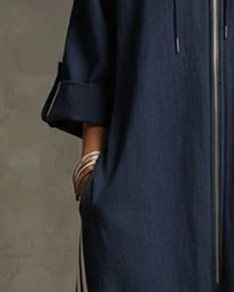 Close-up detail of the high neck and front zipper closure on the white Lotte Women's Jumpsuit.