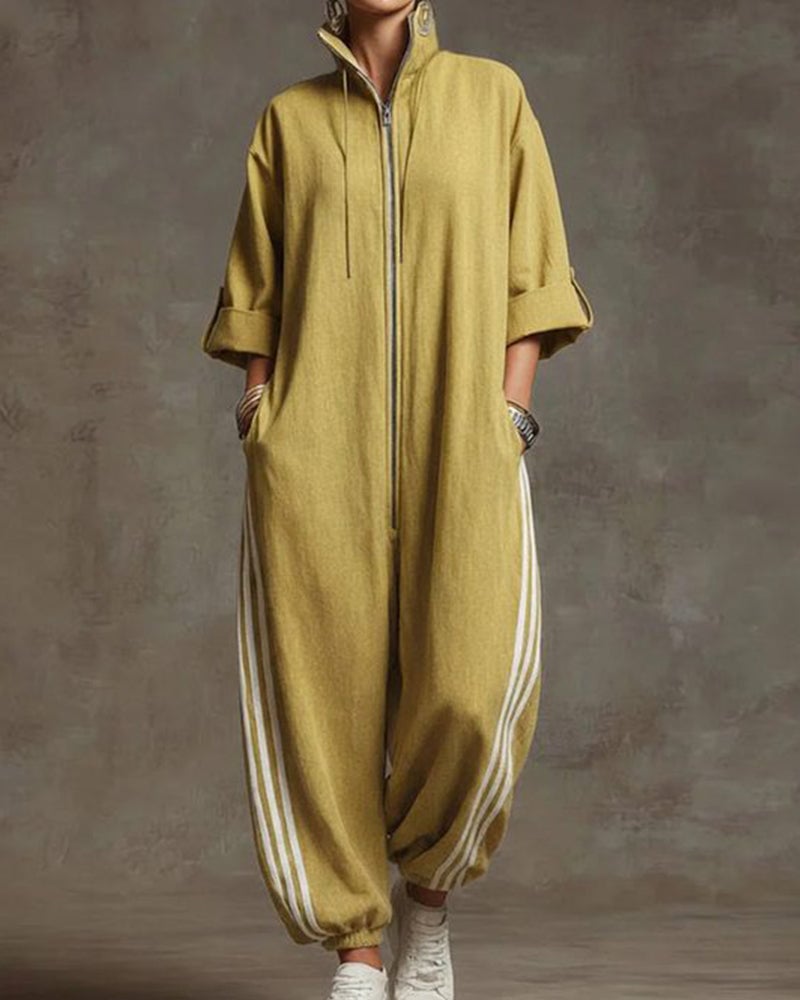 A woman smiling while wearing the yellow Lotte Women's Jumpsuit, emphasizing its comfortable appeal.