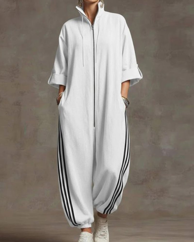 Woman sitting casually, showing the relaxed fit and comfortable stretch of the white Lotte Women's Jumpsuit.