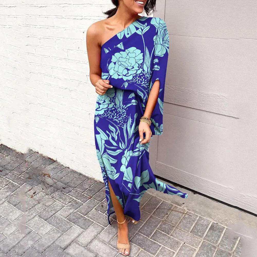 Front view of the Lumi floral one-shoulder dress, showcasing its vibrant pattern and elegant drape.