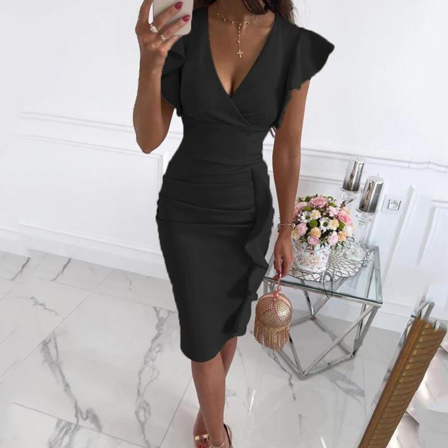 Woman laughing and enjoying herself while wearing the beautiful floral V-neck dress, perfect for summer.