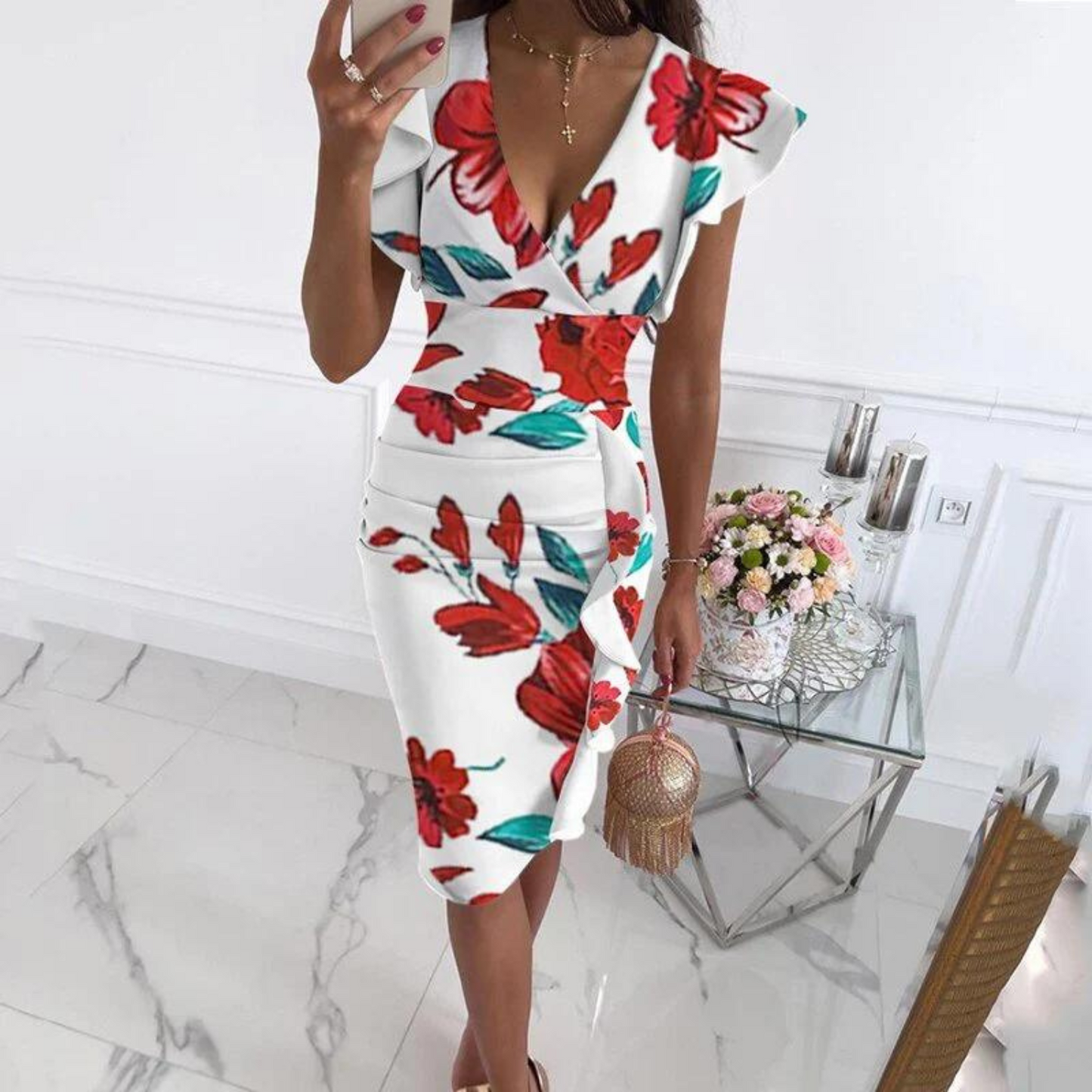 Close-up detail of the delicate floral pattern and soft fabric texture on the V-neck dress.