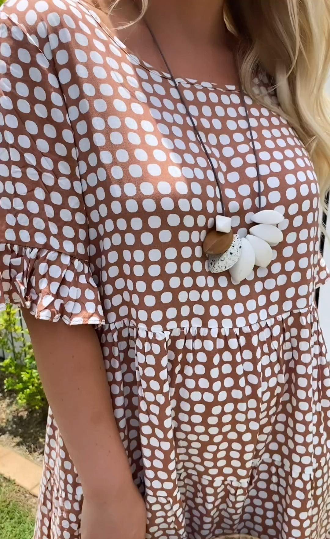 Detailed fabric texture of the lightweight material used in the construction of the boho midi dress.