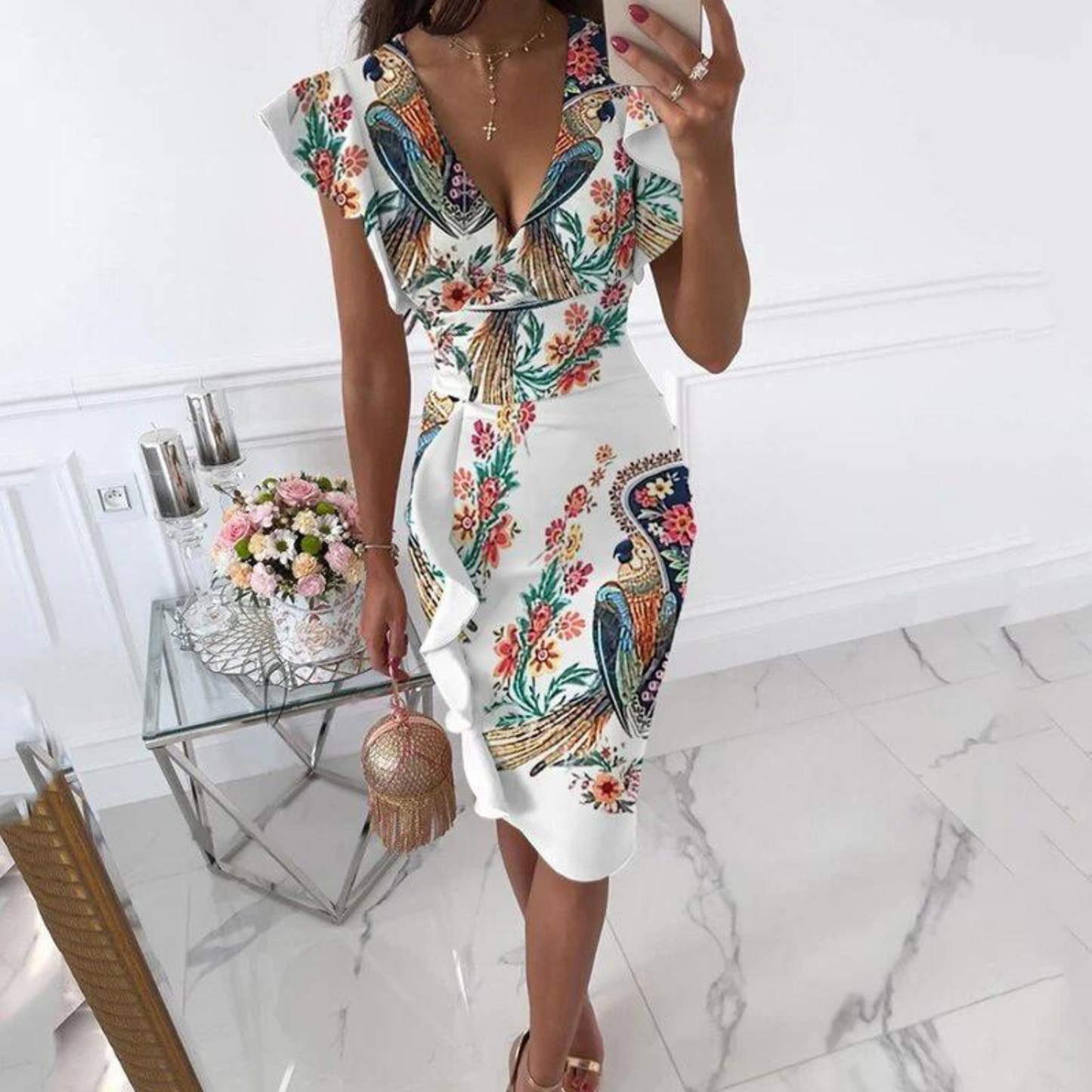 Woman confidently walking in the stylish floral V-neck dress, demonstrating its movement and elegance.
