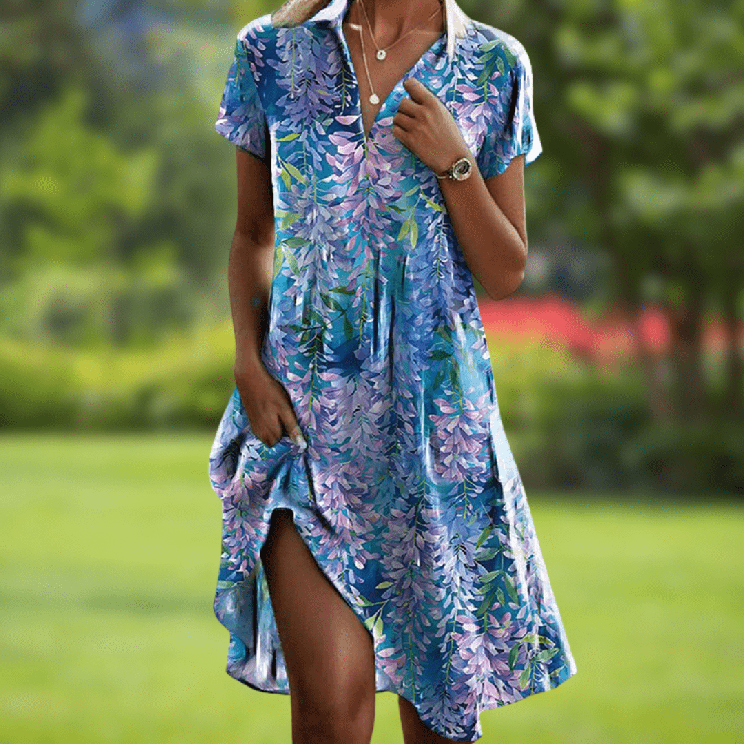 Front view of the vibrant floral summer dress, featuring a colorful pattern and flowing silhouette.