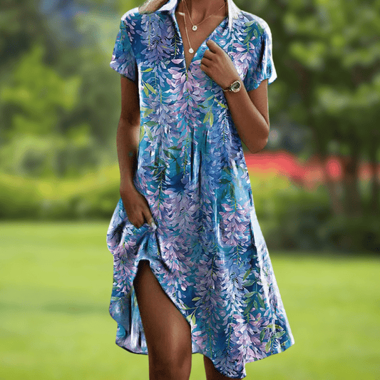 Front view of the vibrant floral summer dress, featuring a colorful pattern and flowing silhouette.